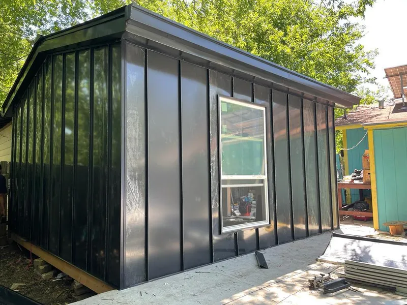 Black standing seam metal wall panels for Roof Inspection in Inkster