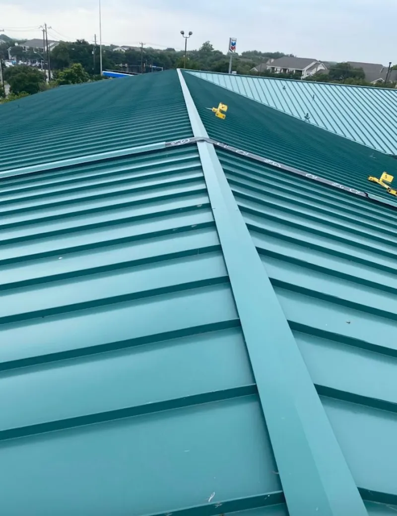 Green commercial metal roof ridge and valley for Metal Roof Repair in Inkster